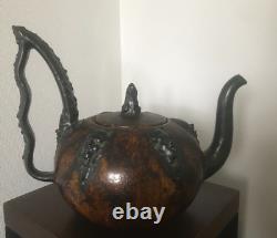 Immense Ceramic teapot with faces signed S HUBLET in Art Nouveau style art.