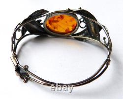Solid silver and Art Nouveau style amber bracelet.