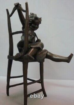 Statue Sculpture of a Girl Sitting in an Art Deco Style Chair in Art Nouveau Style Bronze