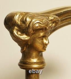 Translation: 'Antique Art Nouveau Style Bronze Cane Handle, Woman's Face'
