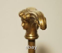 Translation: 'Antique Art Nouveau Style Bronze Cane Handle, Woman's Face'
