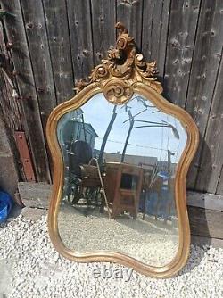 Très beau Miroir biseauté doré de style Louis XV début XXème